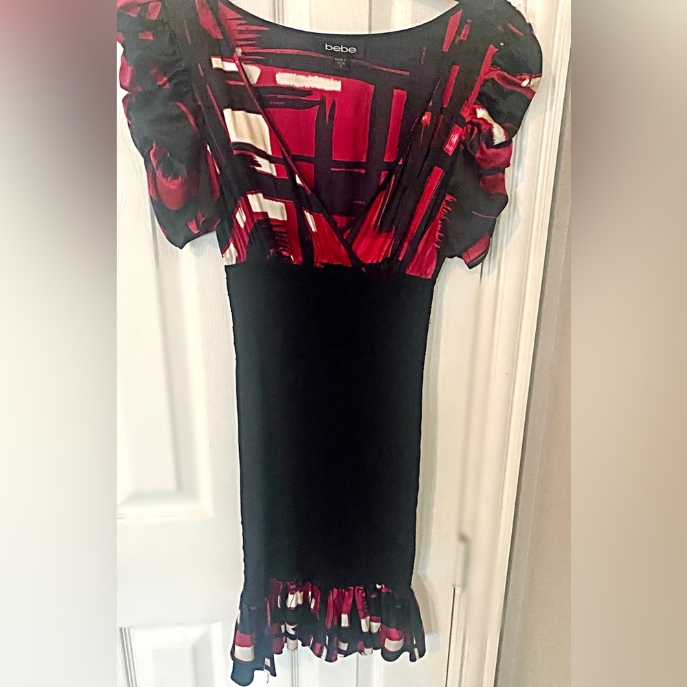 Sexy, classy, BeBe bodycon dress with ruffle cap sleeves & ruffle bottom. - Picture 5 of 5